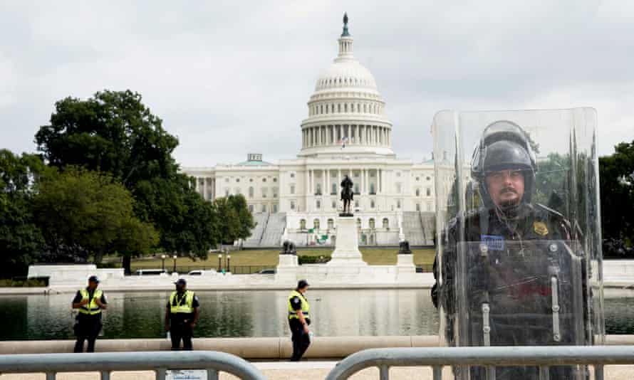 A riot officer stands guard outside the US Capitol in September 2021.