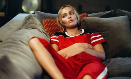 Lily-Rose Depp lying on a sofa in a scene from The Idol.