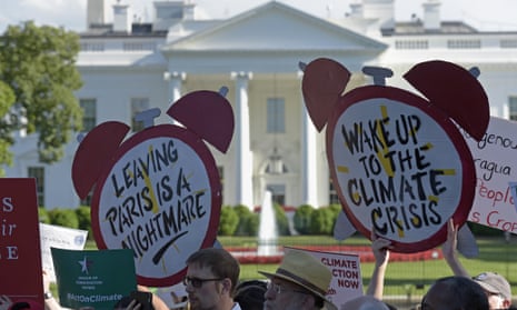 Protesters gather outside the White House in Washington to protest President Donald Trump’s decision to withdraw the Unites States from the Paris climate change accord