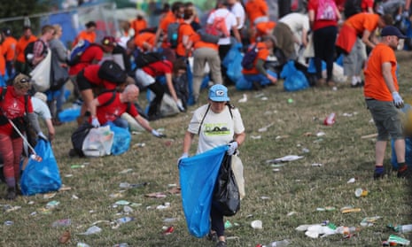 Litter pickers begin the job of clearing the fields at the Glastonbury festival