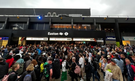 people outside London Euston Station as passengers faced queueing, severe delays