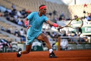 Rafael Nadal plays a backhand return.