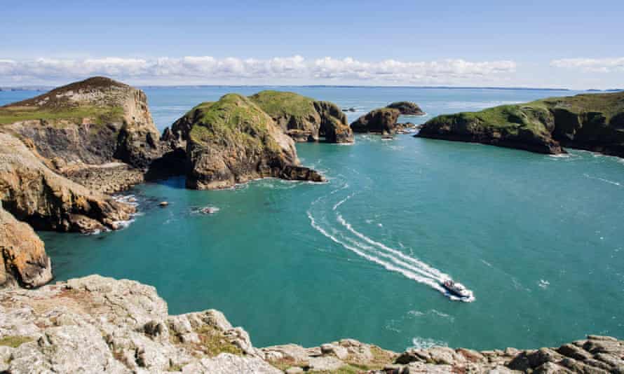 Boat in a bay of Ramsey Island, Pembrokeshire, Wales, United Kingdom.