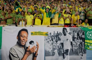 Brazil fans display banners with pictures of Pelé before the last-16 game against South Korea