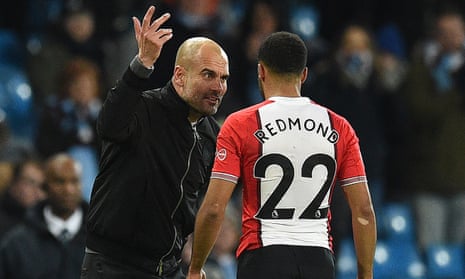 Pep Guardiola speaks to Nathan Redmond in animated fashion following Manchester City’s 2-1 win against Southampton on Wednesday