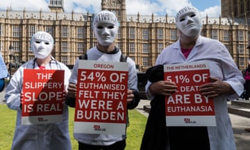 Protest Against Euthanasia and Assisted Dying, London, UK - 29 Apr 2024<br>Mandatory Credit: Photo by Wiktor Szymanowicz/REX/Shutterstock (14454649n) Pro-life campaigners dressed as masked doctors protest outside Parliament against euthanasia and assisted dying as Members of Parliament debate proposals to legalise assisted dying. Protest Against Euthanasia and Assisted Dying, London, UK - 29 Apr 2024