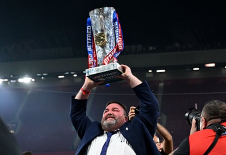 Matt Ellis holds the Super League trophy at Old Trafford