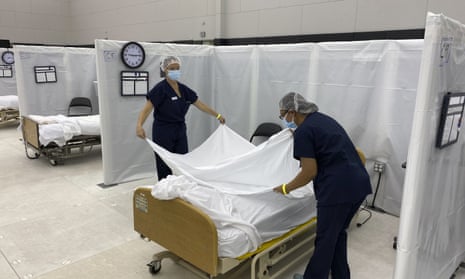 Hospital beds are set up in the practice facility at Sleep Train Arena in Sacramento, California, that is ready to receive patients as needed.