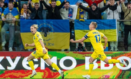 Mykhailo Mudryk (left) celebrates his winning extremity successful Ukraine’s playoff triumph against Iceland.