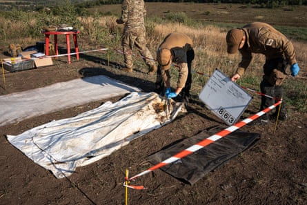 Search volunteers face a complex, delicate task in recovering the bodies.
