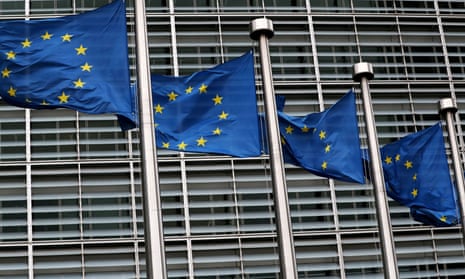 EU flags fly outside the European Commission headquarters in Brussels.