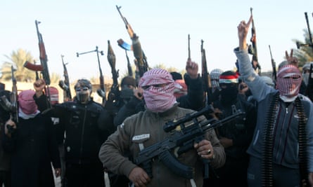 Masked Sunni gunmen chant slogans during a protest against Iraq’s Shia-led government, demanding that the Iraqi army not try to enter the city, in Falluja, 31 miles west of Baghdad, on 7 January 2014.