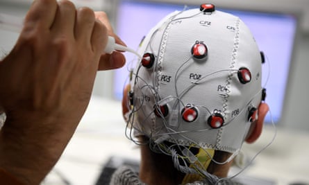 A researcher uses a brain-computer interface helmet at the Centre National de la Recherche Scientifique, Grenoble.
