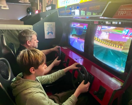 Guardian journalist Martin Belam beating his son James at a racing simulator at Four Quarters Arcade Bar, in Hackney – before getting a drubbing on the Playstation at home.