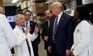 Donald Trump at the National Institutes of Health’s Vaccine Research Center in Maryland, 3 March. The president sowed confusion by pressing for a vaccine to be ready by the US elections.