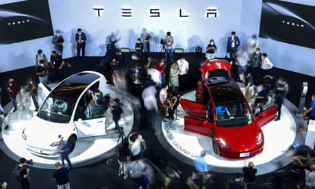 Tesla Model Y cars are demonstrated at a car show