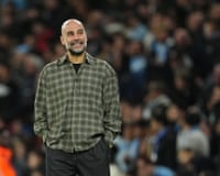 Manchester City manager Pep Guardiola reacts during a Champions League match at the Etihad Stadium