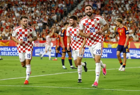 Croatia's Dion Drena Beljo (right) celebrates after scoring their equaliser in Spain.