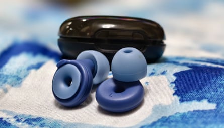blue Loop earplugs shown outside of their case