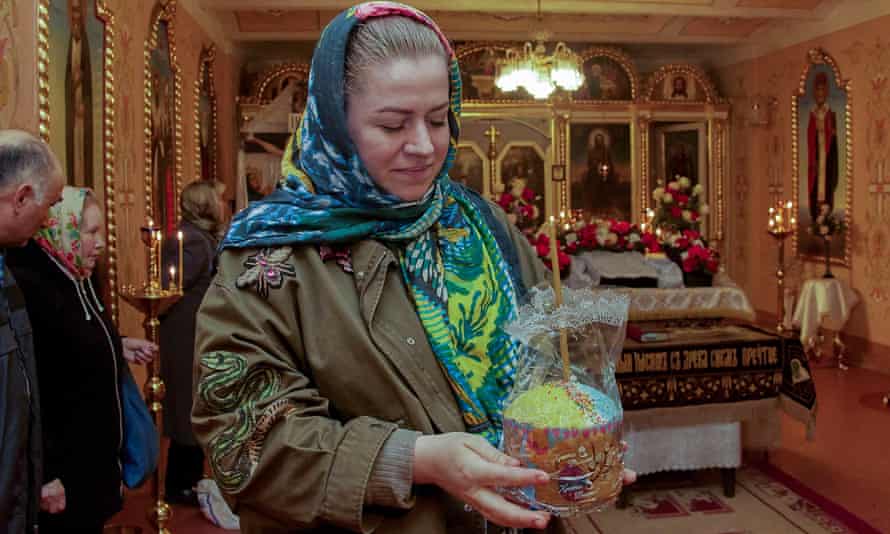 Ukrainian believers attend an Orthodox Easter mass with baskets of painted eggs and kulichi, a traditional Easter cake, in the Eastern Ukrainian city of Kharkiv, Ukraine.