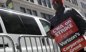 A
striking CWA member pickets in front of Verizon Communications
Inc. corporate offices in New York CityA member of the
Communications Workers of America (CWA) pickets in front of
Verizon Communications Inc. corporate offices during a strike in
New York City, April 13, 2016. REUTERS/Brendan McDermid