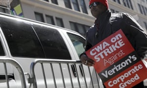 A
      striking CWA member pickets in front of Verizon Communications
      Inc. corporate offices in New York CityA member of the
      Communications Workers of America (CWA) pickets in front of
      Verizon Communications Inc. corporate offices during a strike in
      New York City, April 13, 2016. REUTERS/Brendan McDermid