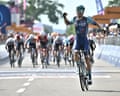 Belgian rider Alec Segaert of Bahrain Victorious team crosses the line to win the 12th stage