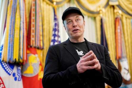 a man in a black suit and hat
