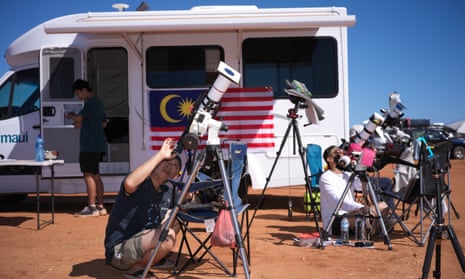 People preparing and watching the total solar eclipse at a viewing site 35km from Exmouth, Western Australia, Thursday, April 20, 2023.