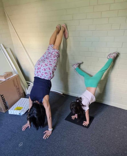 Kelly Eng with daughter demonstrates the sickly green walls before the reno.