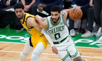 Celtics forward Jayson Tatum (0) drives the ball against Pacers guard Tyrese Haliburton (0) in overtime during Tuesday’s Game 1 of the Eastern Conference finals in Boston.