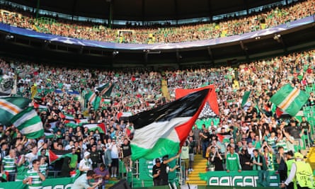 Celtic fans fly Palestine flags during their Champions League play-off against Hapoel Be’er Sheva.