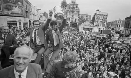 Peter Bonetti, right, and Ron Harris hold the trophy aloft as the Chelsea football team return in triumph to the King’s Road in London after their FA Cup final victory, 1970.
