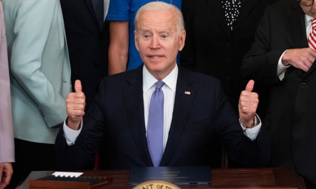 TOPSHOT-US-POLITICS-BIDEN-CRIMES-ACT<br>TOPSHOT - US President Joe Biden gives thumbs-up after signing H.R. 1652, the VOCA Fix to Sustain the Crime Victims Fund Act of 2021, which redirects monetary penalties to increase funding for victim compensation funds, during a ceremony in the East Room of the White House in Washington, DC, July 22, 2021. (Photo by SAUL LOEB / AFP) (Photo by SAUL LOEB/AFP via Getty Images)