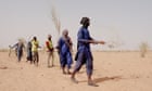 ‘There are snakes – but we attack the fires’: refugees fight flames in the Sahara