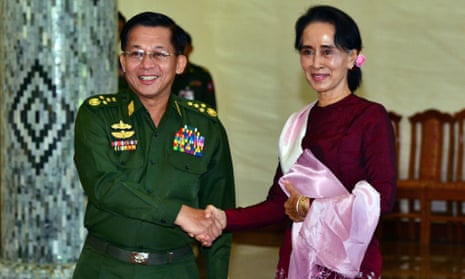Min Aung Hlaing shakes hands with Aung San Suu Kyi