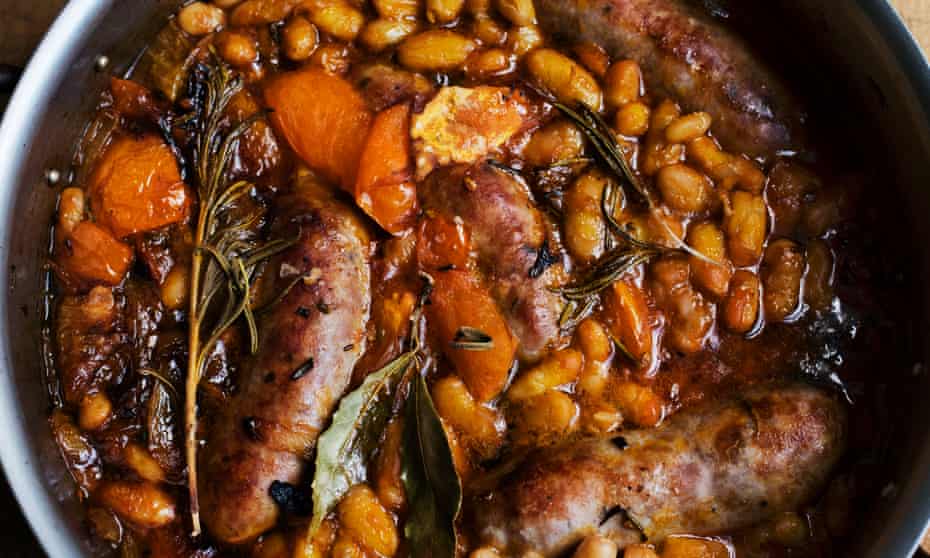 Brilliant bangers: baked sausages with harissa and tomatoes.