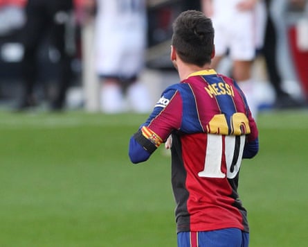 Lionel Messi, then playing for Barcelona, wears a Maradona 10 Newell’s Old Boys shirt under his own Messi 10 Barcelona shirt as a tribute to Diego Maradona who had recently died.