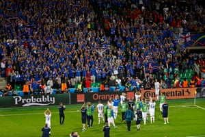 Iceland players applaud the fans.