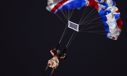 An actor dressed as the Queen parachutes during the opening ceremony of the London 2012 Olympic Games.