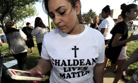 Astevana Shaya, 28, of Sterling Heights, Michigan, wears a Chaldeans Lives Matter T-shirt at a protest on 12 June. The arrests of dozens of Iraqi Christians in southeastern Michigan by US immigration officials appear to be among the first roundups of people from Iraq who have long faced deportation.