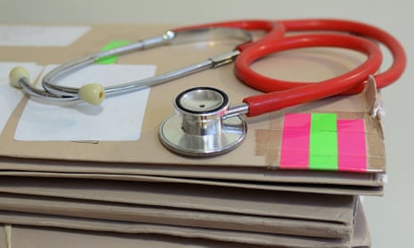 a stethoscope on top of patient's files