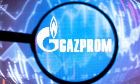 Gazprom logo under a magnifying glass