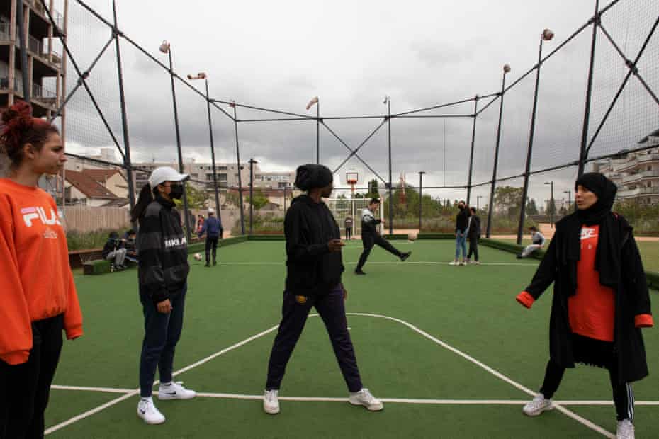 Les Hijabeuses during a training session at Montreuil football pitch, the group share the ground with other young people from the area.