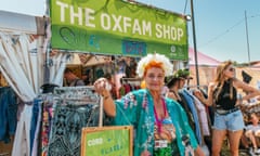 Oxfam volunteer Lesley organising merchandise in the onsite Oxfam shop at the Glastonbury festival in 2019.