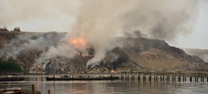 Fire burning at scrap-heap causing serious pollution to the environment.