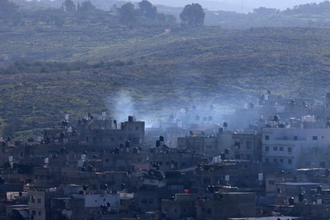 Smoke rises above Tulkarm during the Israeli raid in the Israeli-occupied West Bank on 18 January.