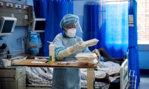 A nurse hands out meals to her patients in Ga-Rankuwa, South Africa.