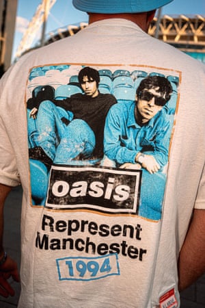 Close-up of the back of a T-shirt with Oasis Represent Manchester 1994 emblazoned on it.