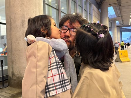 Idris and his two daughters at the airport